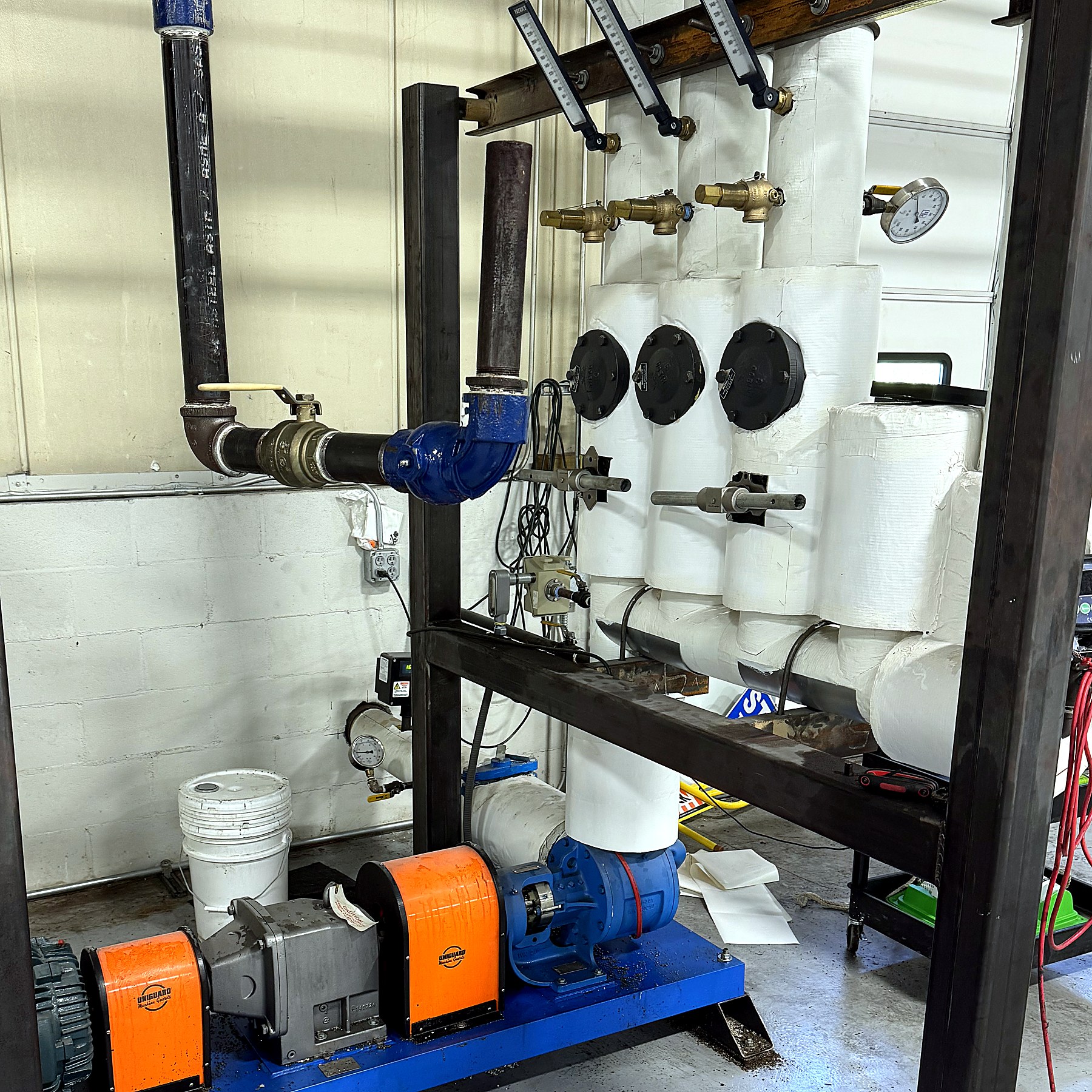 Transfer pump skid and process piping at the Creative Polymer Solutions warehouse