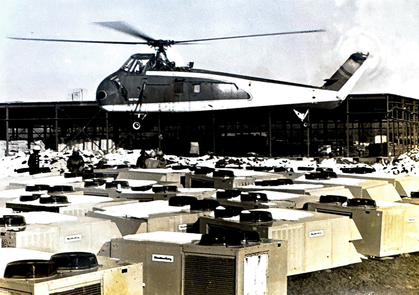 Helicopter setting rooftop HVAC units at the Hyster plant expansion, 1978