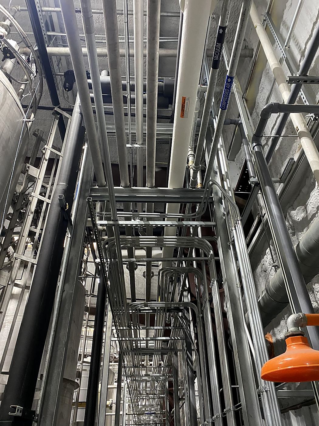 Looking up through a stainless pipe rack
