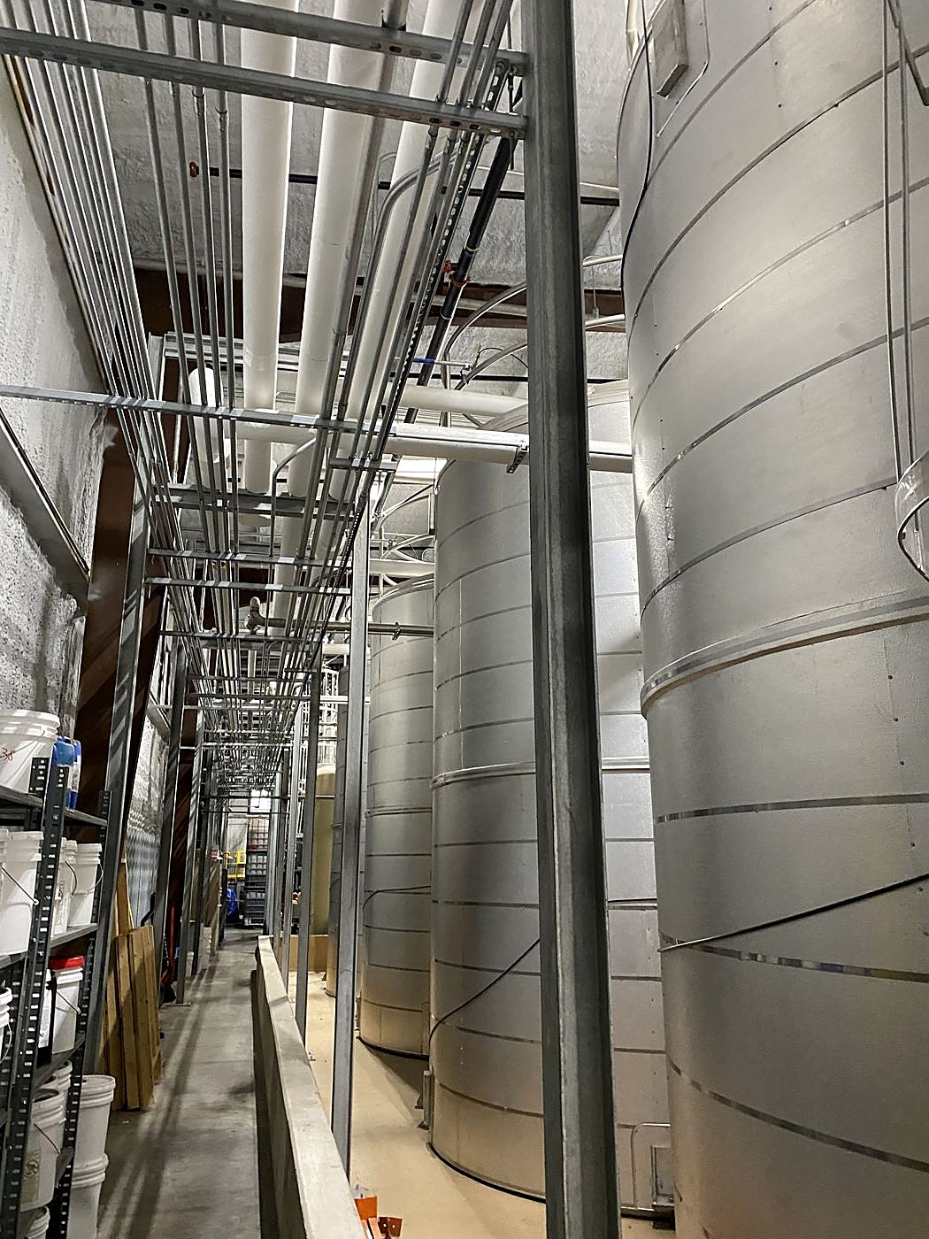 Stainless bulk tanks and pipe rack installed by EMCO