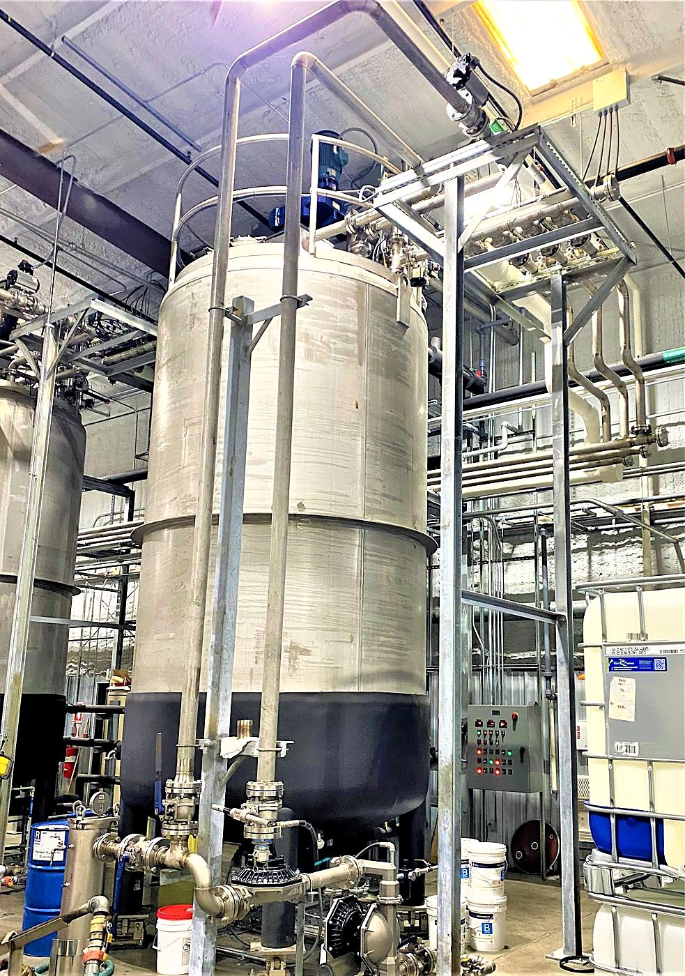Stainless process vessel with piping and supports